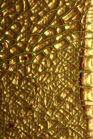 Cracked golden paint on canvas close up modern background high quality printの写真素材
