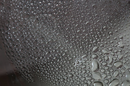 Water droplets in transparent bottle close up modern background high quality prints