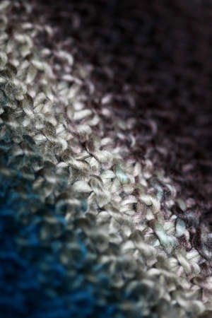 Colorful handmade winter scarf with alpacas wool macro background modern high quality print
