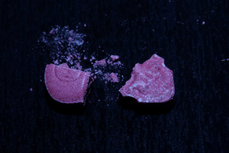 Pink skull ecstasy pill close up background high quality prints purple army dope narcotics substance...
