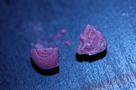 Pink skull ecstasy pill close up background high quality prints purple army dope narcotics substance...