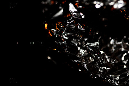 Crumbled aluminum foliage close up abstract background modern big size crazy silver look high quality inspirational printの写真素材