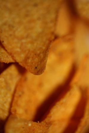 Homemade tortilla spicy chips made with flat bread and baked in oven close up macro background big size high quality instant eating printの写真素材