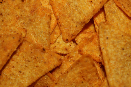 Homemade tortilla spicy chips made with flat bread and baked in oven close up macro background big...
