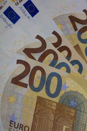 200 euro banknotes european bill cash money isolated on black background two hundred euro close up...