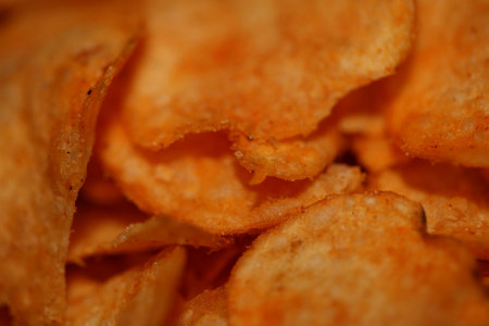 Top view of potato chips with paprika spice fast food concept eating junk food background high quality big size instant print stock photographyの写真素材