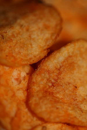 Top view of potato chips with paprika spice fast food concept eating junk food background high...