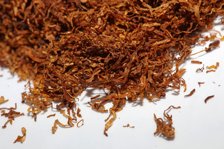 Rolling tobacco leaves lucky strike macro background stock photography high quality dried chopped premium smoking instant printsの写真素材