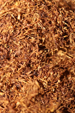 Rolling tobacco leaves lucky strike macro background stock photography high quality dried chopped premium smoking instant printsの写真素材