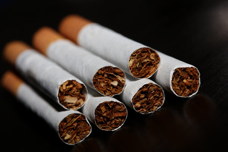 A view from a number of cigarettes isolated on black background tobacco close up quit smoking cessation cigaret bad habit nicotine junkie big size high quality instant printの写真素材