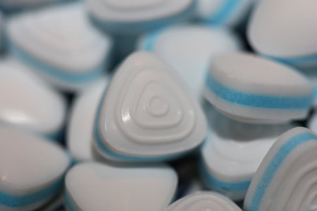 Group of sweet colorful candy light blue triangle refreshment caramel bubble gum close up background modern high quality big size instant stock photography printsの写真素材