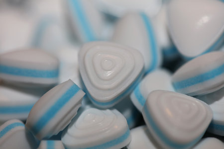 Group of sweet colorful candy light blue triangle refreshment caramel bubble gum close up background modern high quality big size instant stock photography printsの写真素材