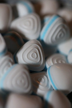 Group of sweet colorful candy light blue triangle refreshment caramel bubble gum close up background modern high quality big size instant stock photography printsの写真素材