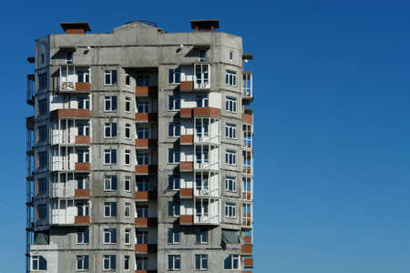 Not completed building against a blue sky.                           の写真素材