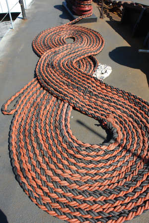 A rope stored on deck of warship                               