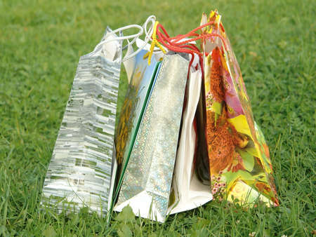  5 bags with gifts on the grass                              の写真素材