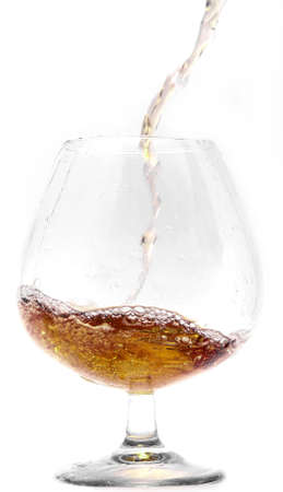 Pouring cognac into a Glass.                               の写真素材