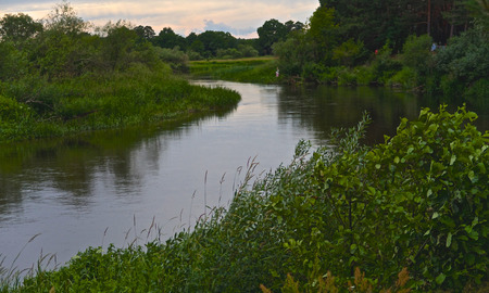 Neman river and green meadows at summer evening, Minsk region