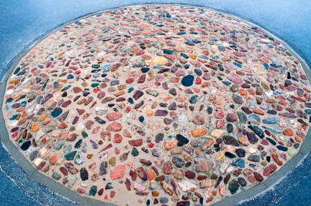 Round mosaic of stones of different colorsの写真素材