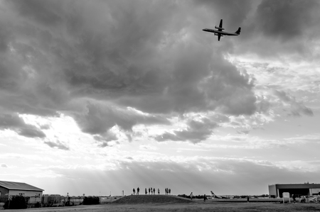 Montreal, Canada- July 3, 2016: Group of people making photos of planes at observation point near Montreal Airportのeditorial素材