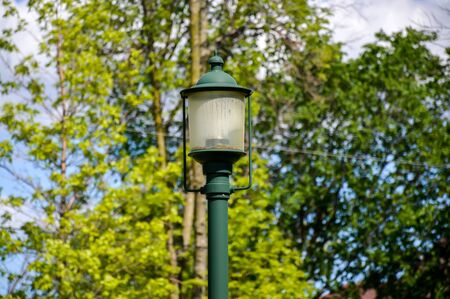 The old green lantern in the park of Canadaの写真素材