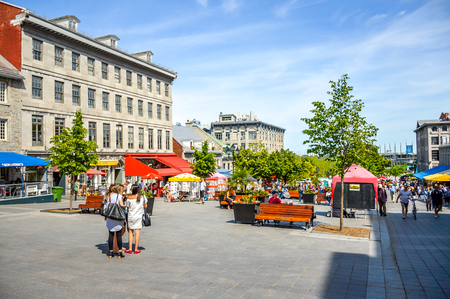 Montreal, Canada - June 15, 2017: Tourists on Jacques Cartier place.Place Jacques-Cartier is a square located in Old Montreal and an entrance to the Old Port of Montreal. People can be seen around.のeditorial素材