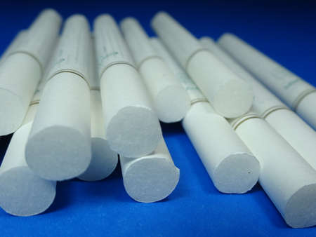 bunch of menthol cigarettes on blue background