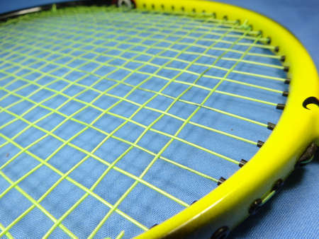 A yellow  badminton racket. photo taken in Malaysiaの写真素材