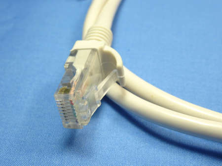 A LAN cable head in blue background
