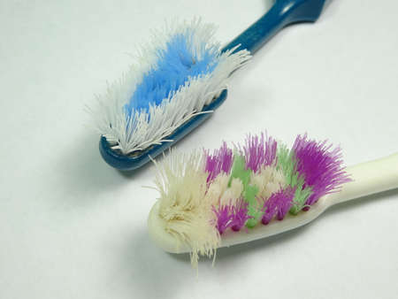 worn out toothbrush in white background. Photo taken in Malaysia