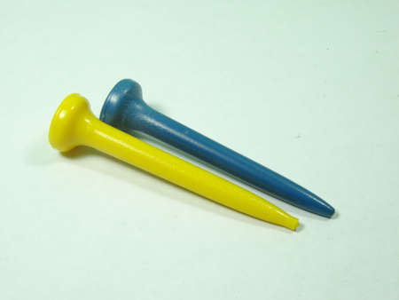 golf  ball tee on white backgroundの写真素材