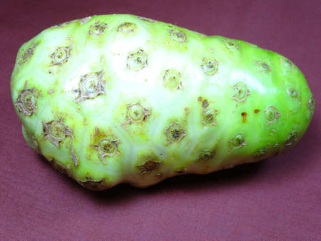A ripe cheese fruit close up in brown background, photo taken in Malaysia
