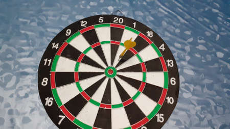 dart board on   blue background. photo taken in malaysiaの写真素材