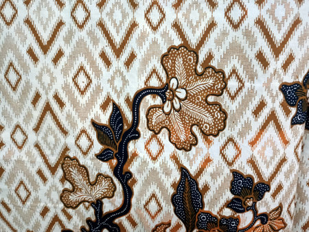 texture of batik print fabric striped colourful  flowers background.Malaysian culture batik cloth....