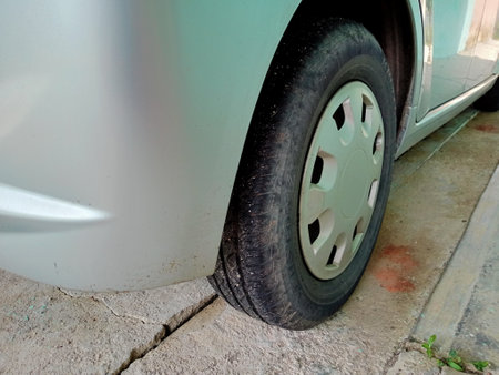 Car tire on the road, close-up of car wheel.photo taken in malaysiaの写真素材