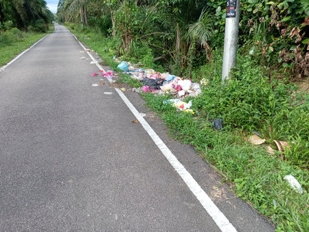 illegal garbage dump site on roadside in kluang, johor, malaysiaの写真素材