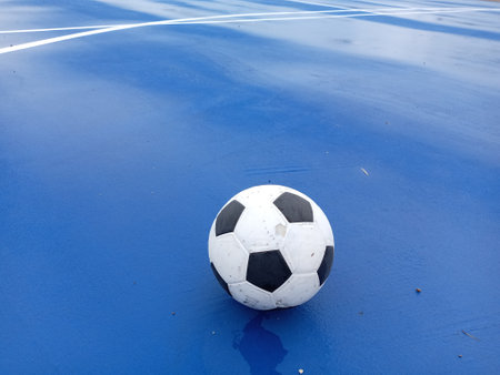 futsal ball on a blue surface of a futsal field, closeup of photo taken in malaysiaの写真素材