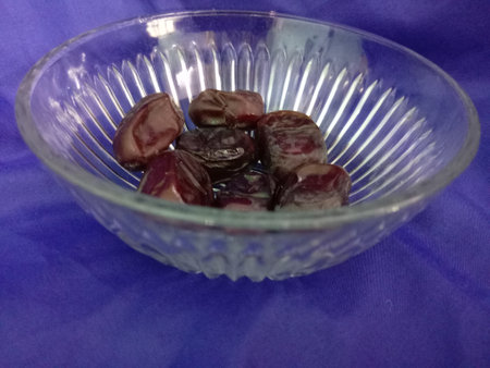Close-up of dried dates in a bowl. Selective focus.