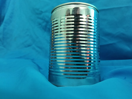 metal tin  can on a blue background. Close-up  of can  view.photo taken in malaysia