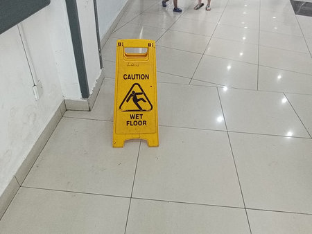 Signs warning of wet floor in the public area in malaysiaの写真素材
