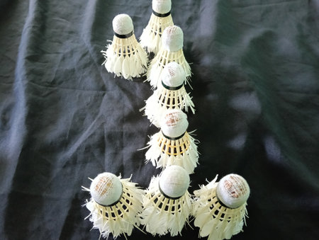 worn out or used shuttlecocks arrange in number one shape  on a  black background  close up. Photo taken in Malaysiaの写真素材