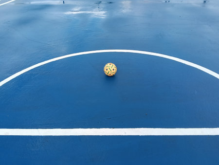 synthetic sepaktakraw or takraw or  buka ball, kick volleyball or foot volleyballball on blue background court , closeup of photo taken in malaysia.の写真素材