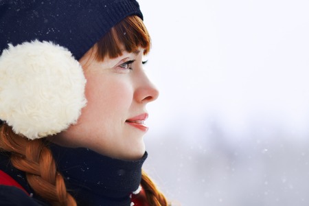 portrait of redhead woman on the winter walk in the parkの写真素材