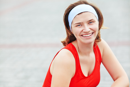Portrait of sporty smiling woman. outdoor sports. healthy lifestyleの写真素材