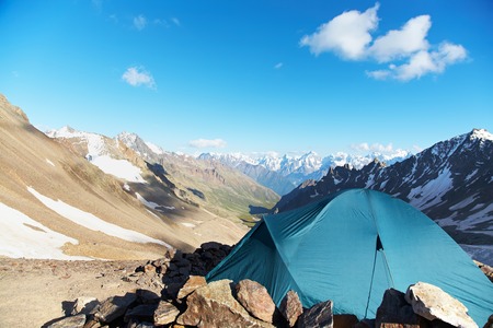 tent in the mountains. alpine camp. summer hiking