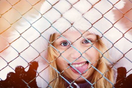 portrait of a funny girl on a walk in the winter. teen outdoorsの写真素材