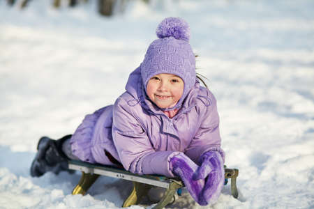 portrait of a cheerful girl walking around outdoors in the winter