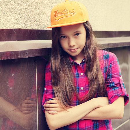 Beautiful teenage girl outdoors. youth lifestyle. portrait of adolescent in the cityの写真素材