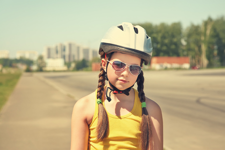 Little girl on roller skates at a parkの写真素材