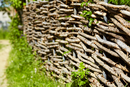 wicker rustic fence in the gardenの写真素材